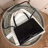 Styled lifestyle shot of sleek classic women's handbag – women's everyday handbag