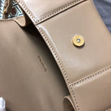Side profile of modern sleek women's handbag – women's luxury accessory
