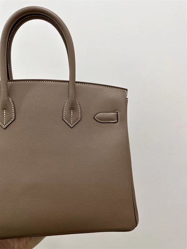 Side view of modern structured handbag