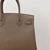 Side view of modern structured handbag