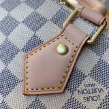 Back view of sleek classic women's handbag – women's statement bag