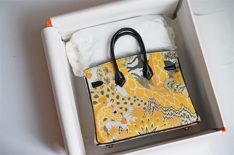  contemporary top-handle bag styled with outfit