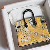 contemporary top-handle bag styled with outfit