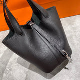 Side view of streamlined structured handbag