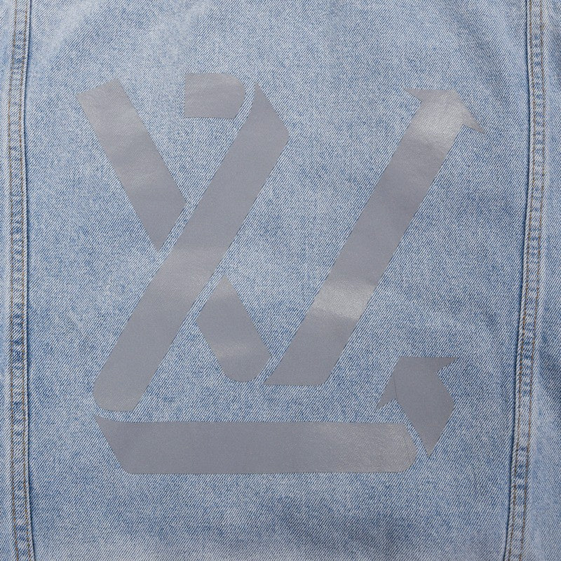 Close-up detail shot of Louis Vuitton luxury clothing with relaxed-fit cut