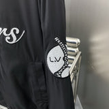 Front view of Louis Vuitton luxury clothing with label-forward styling