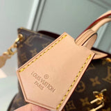 Styled lifestyle shot of refined signature women's handbag – women's luxury handbag