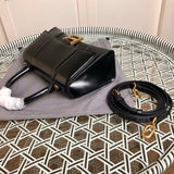Styled lifestyle shot of chic sleek women's handbag – women's luxury accessory