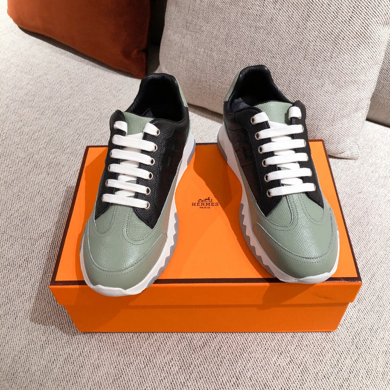 Hermès White High-Top Sneakers - Angled View