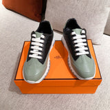 Hermès White High-Top Sneakers - Angled View