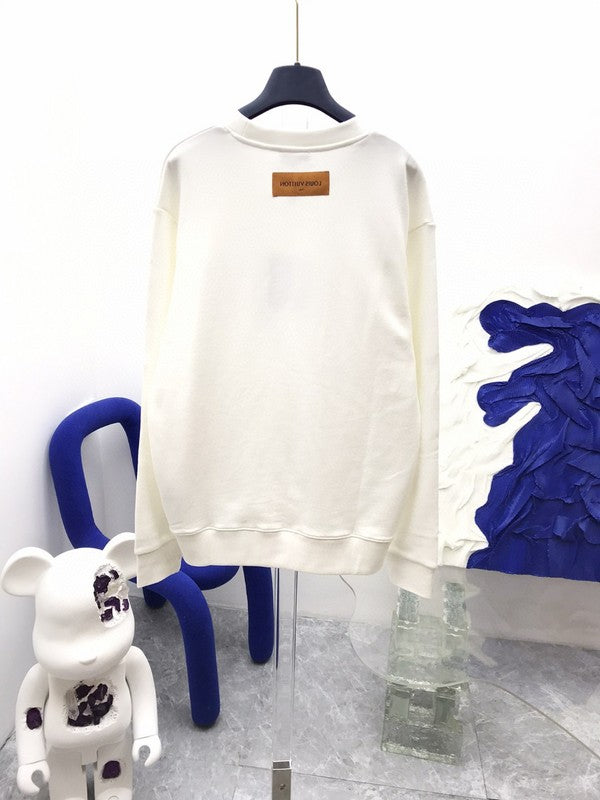Back view of Louis Vuitton luxury clothing with label-forward styling