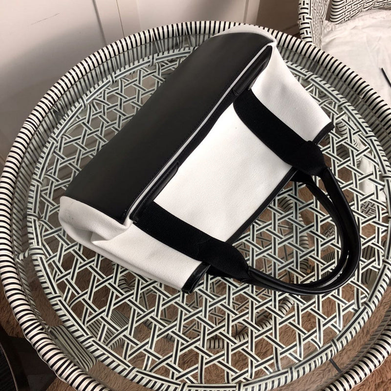 Styled lifestyle shot of everyday-luxe statement women's handbag – women's luxury accessory