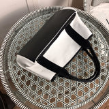 Styled lifestyle shot of everyday-luxe statement women's handbag – women's luxury accessory