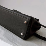  timeless top-handle bag detail view showing craftsmanship 8