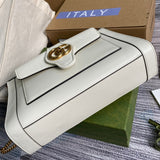Handle and strap detail of signature polished women's handbag – women's designer-style accessory