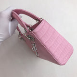 Side profile of signature sleek women's handbag – women's designer-style accessory