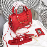 Handle and strap detail of classic structured women's handbag – women's statement bag