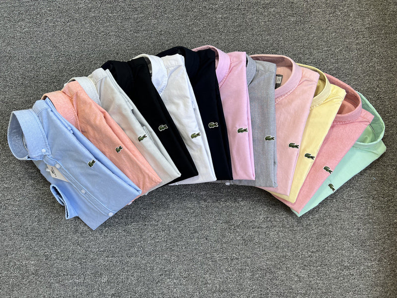 Flat lay presentation of Lacoste luxury clothing with logo-detail design