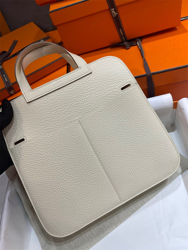 Side view of understated structured handbag