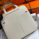 Side view of understated structured handbag