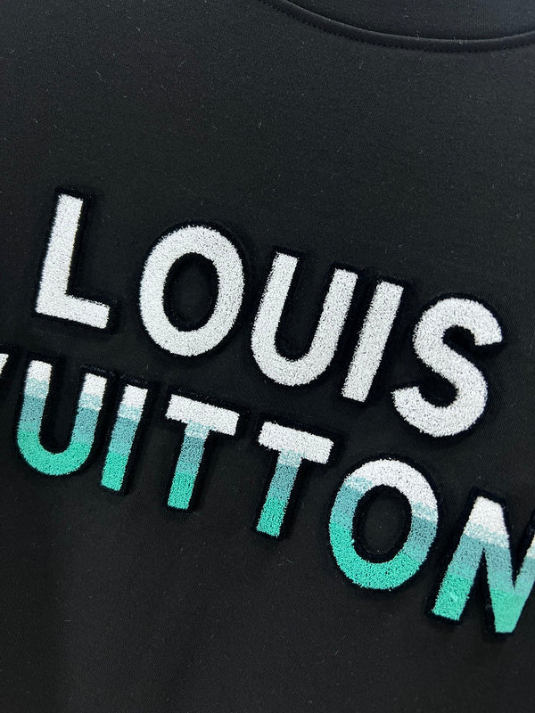 Flat lay presentation of Louis Vuitton luxury clothing with monogram-inspired silhouette