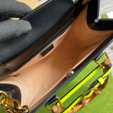 Side profile of polished statement women's handbag – women's premium purse