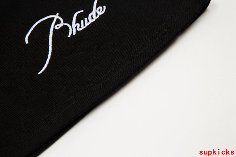 Flat lay presentation of Rhude luxury clothing with contemporary cut