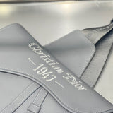 Styled lifestyle shot of statement polished women's handbag – women's designer-style accessory
