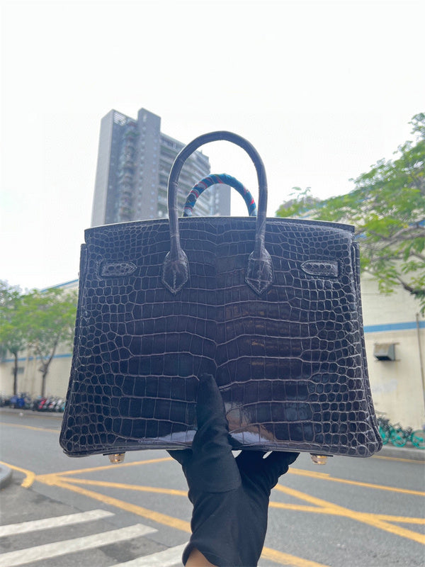Side view of tailored structured handbag