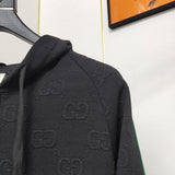 Side profile of Gucci luxury clothing with label-forward styling
