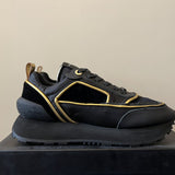 Gucci classic monochrome luxury sneakers view 7 retro runner design