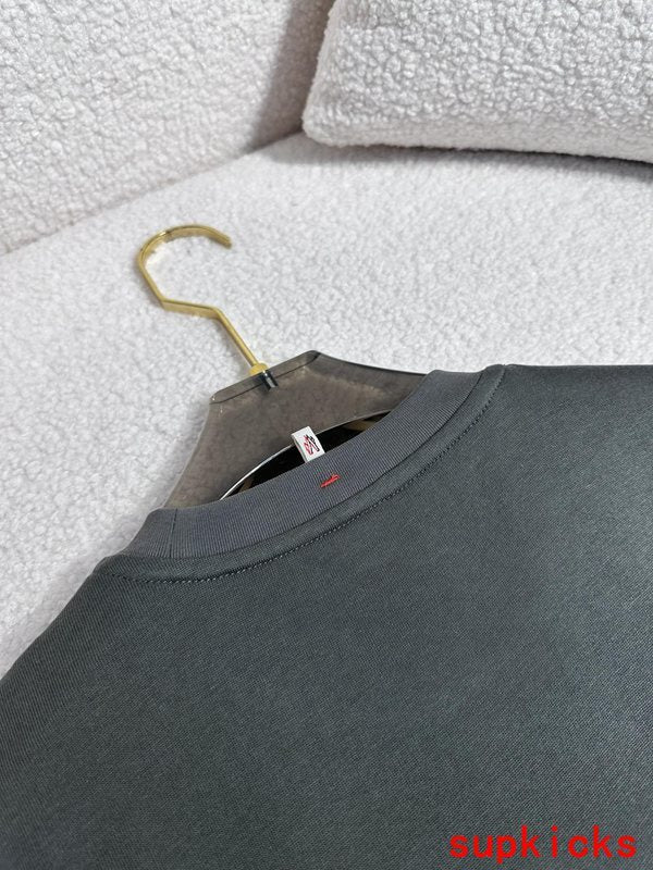Side profile of Moncler luxury clothing with signature branding