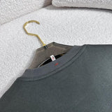 Side profile of Moncler luxury clothing with signature branding