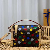 Side profile of structured modern women's handbag – women's luxury handbag