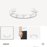 Side view of Cartier unisex jewelry piece
