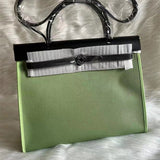 Side view of classic structured handbag