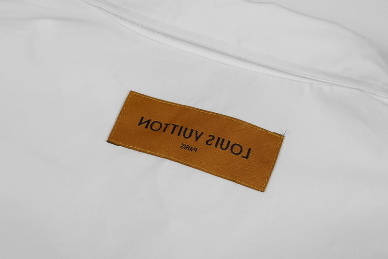 Close-up detail shot of Louis Vuitton luxury clothing with monogram-inspired silhouette