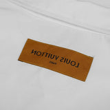 Close-up detail shot of Louis Vuitton luxury clothing with monogram-inspired silhouette
