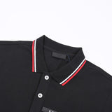 Close-up detail shot of Polo cotton polo shirt with monogram-inspired silhouette
