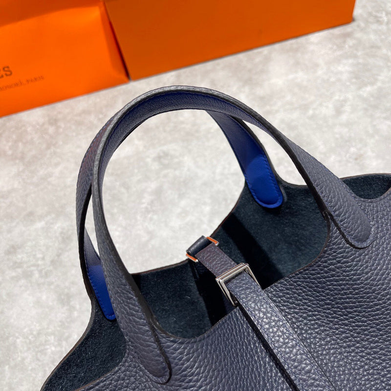 Side view of streamlined structured handbag