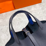 Side view of streamlined structured handbag