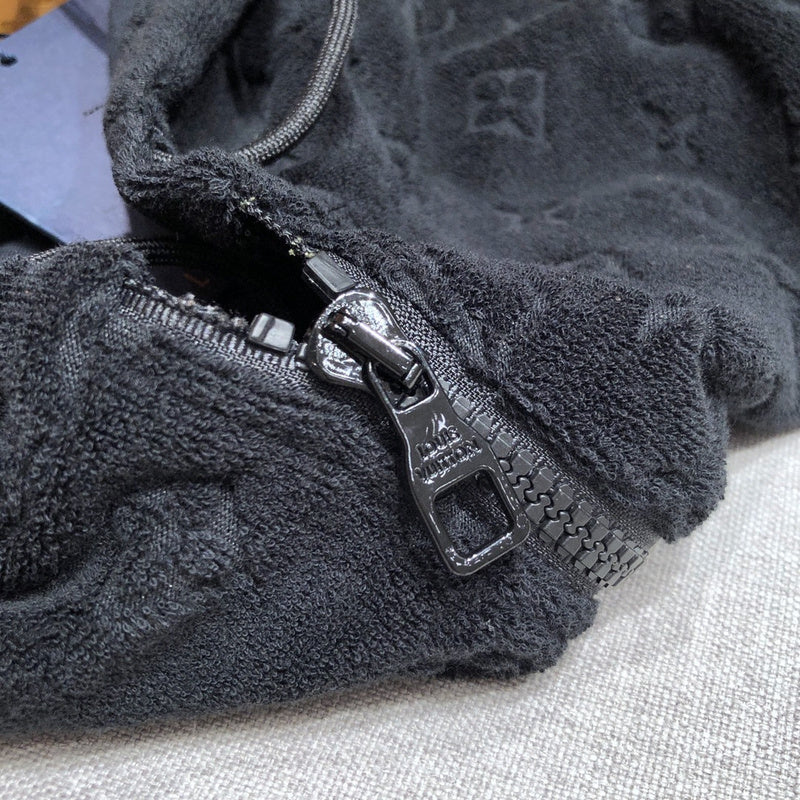 Flat lay presentation of Louis Vuitton luxury clothing with contemporary cut