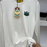 Back view of Gucci luxury clothing with logo-detail design