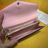 Handle and strap detail of refined signature women's handbag – women's designer-style accessory