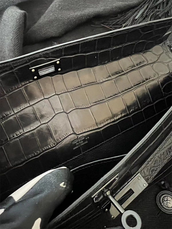 Side view of poised structured handbag