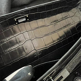 Side view of poised structured handbag
