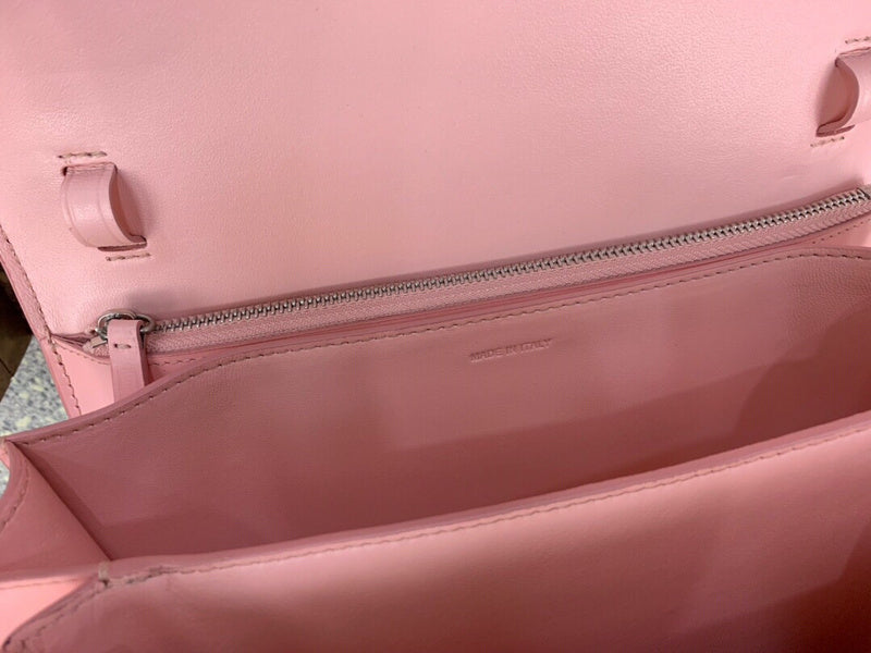 Side profile of modern structured women's handbag – women's statement bag