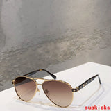 Close-up detail view of Louis Vuitton unisex sunglasses