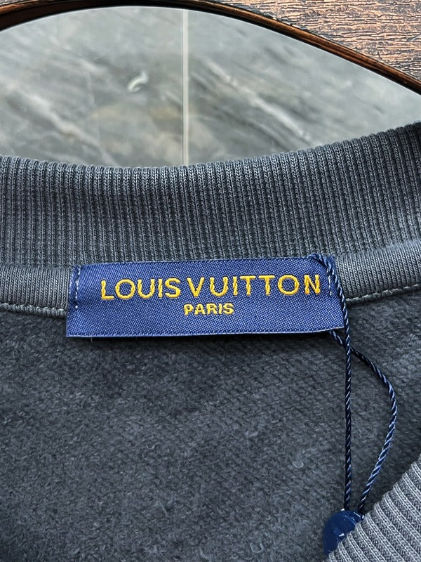 Side profile of Louis Vuitton luxury clothing with tailored silhouette