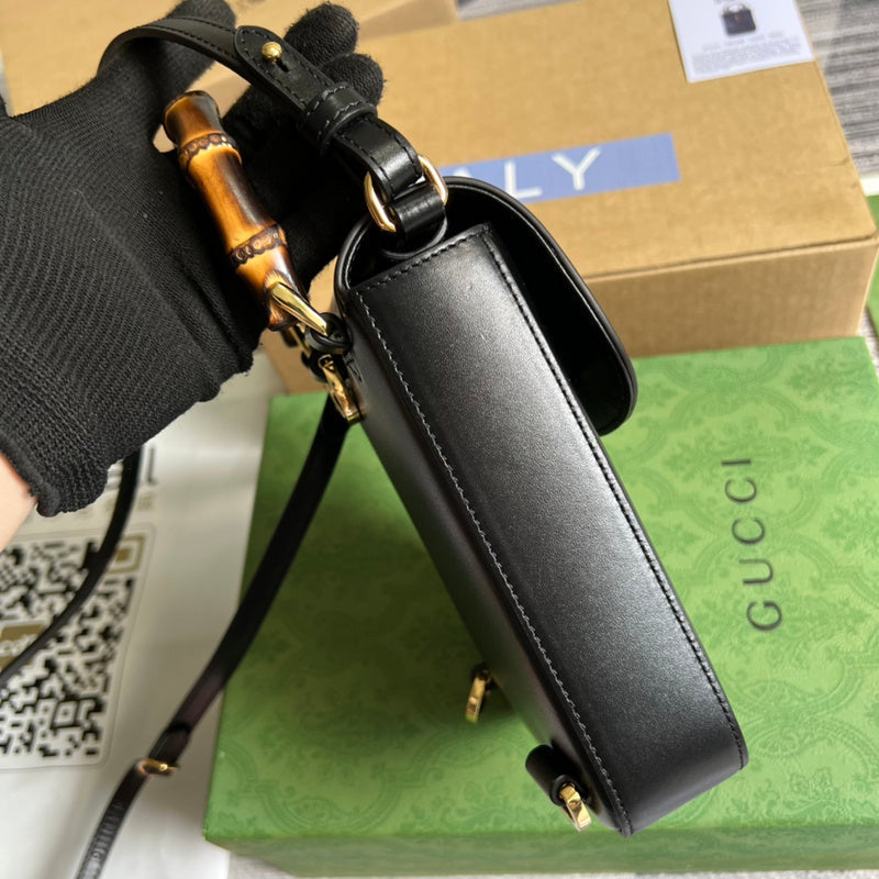 Handle and strap detail of sleek signature women's handbag – women's luxury accessory